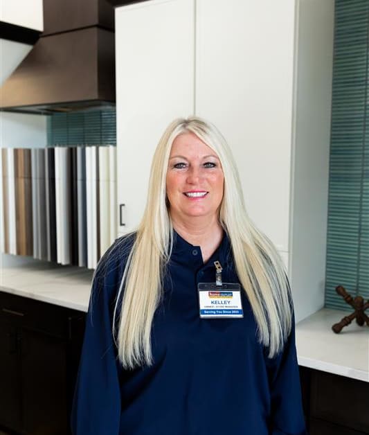A friendly Home Outlet representative poses for a picture in-store.